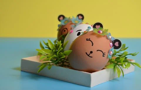 Easter eggs on a yellow-blue background. Easter. Stock Photos