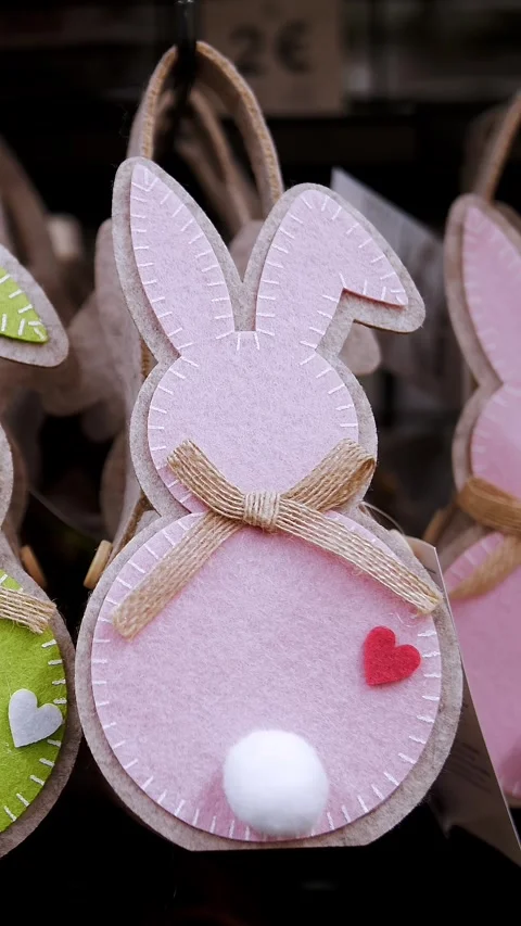 Easter fair. close-up. decorative, Easter gift felt bunny bags, on a display in Stock Footage 314980305