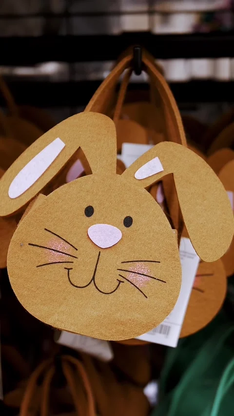 Easter fair. close-up. decorative, Easter gift felt bunny bags, on a display in Stock Footage 316782163
