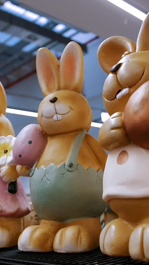 Easter fair. close-up. Different funny Easter bunny figurines, statuettes. Stock Footage 317315490