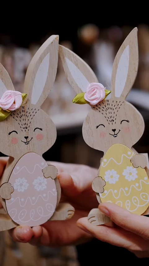 Easter fair. close-up. female hands holding Easter decorations. funny figurines Stock Footage 316987821