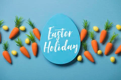 Easter festive background with easter bunny carrots and easter eggs Stock Photos