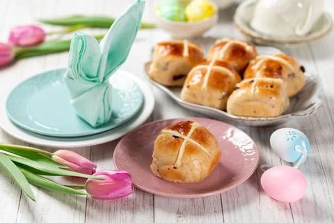 Easter festive dessert table with hot cross buns Stock Photos