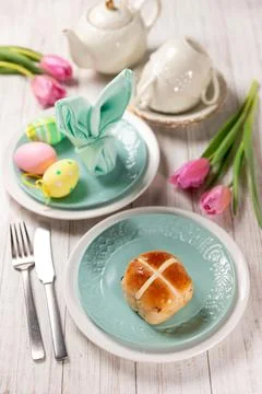 Easter festive dessert table with hot cross buns Stock Photos