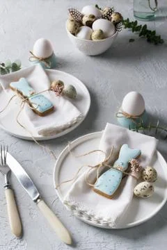 Easter  festive table setting with Easter bunny cookies, quail eggs Stock Photos