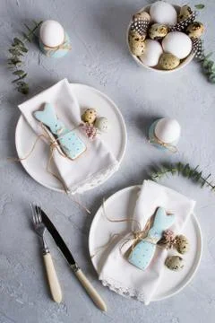 Easter  festive table setting with Easter bunny cookies, quail eggs Stock Photos