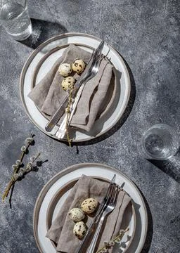 Easter festive table setting with quail eggs. top view Stock Photos