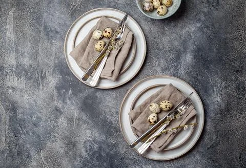 Easter festive table setting with quail eggs. top view Stock Photos