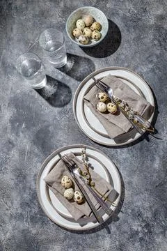 Easter festive table setting with quail eggs. top view Stock Photos
