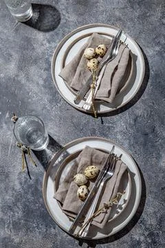 Easter festive table setting with quail eggs. top view Stock Photos