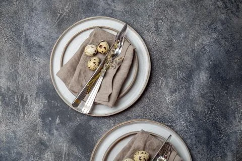 Easter festive table setting with quail eggs. top view Stock Photos