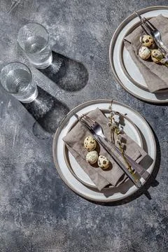 Easter festive table setting with quail eggs. top view Stock Photos