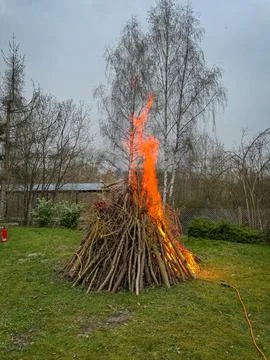 An Easter fire burns in the meadow Stock Photos