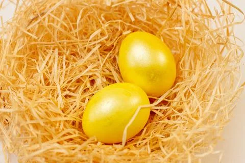 Easter flat lay of golden Eggs in yellow backset Stock Photos