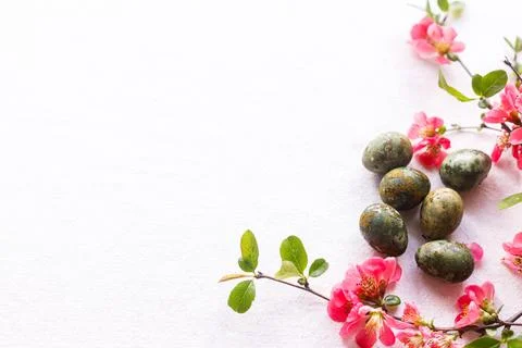 Easter flat lay. Stylish easter eggs and red flowers on rustic linen backgr.. Stock Photos