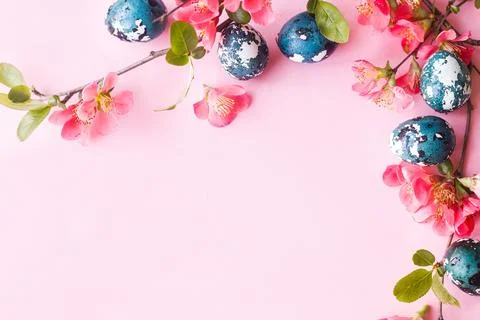 Easter flat lay. Stylish easter eggs and red flowers on pink background. Ea.. Stock Photos