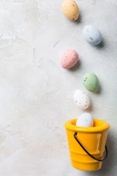 Easter flat lay with yellow ceramic bucket Stock Photos