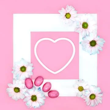 Easter Flower Background Heart Frame with Chocolate Eggs Stock Photos