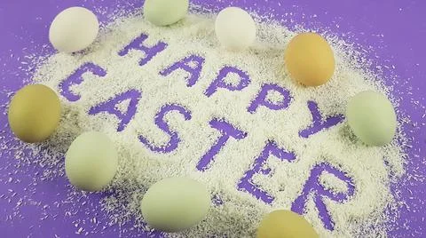 Easter frame with eggs and feathers on a blue wooden background. Top view. Ca Stock Photos