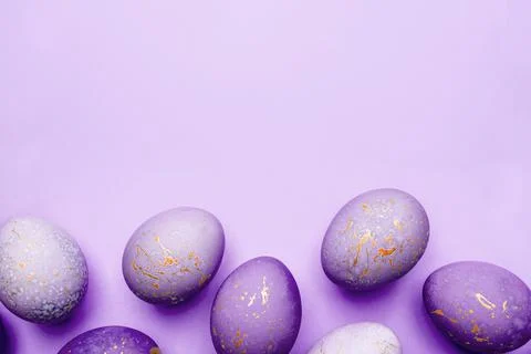 Easter frame of eggs painted in purple color. Stock Photos