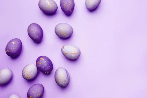 Easter frame of eggs painted in purple color. Stock Photos