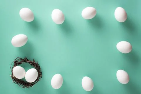 Easter frame with the image of eggs on a light blue background. Space for text Stock Photos