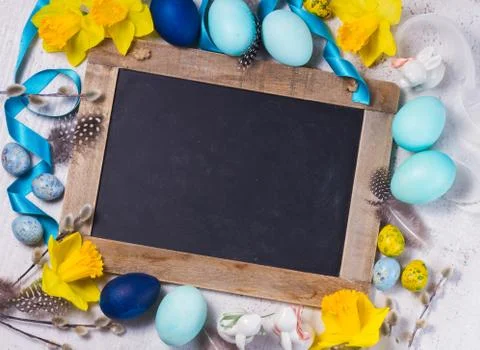 Easter frame with painted eggs and flowers Stock Photos