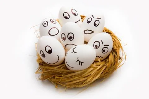 Easter funny eggs in nest Stock Photos