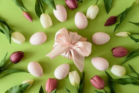Easter Gift Box with Eggs and Spring Tulips on Green Background Stock Photos