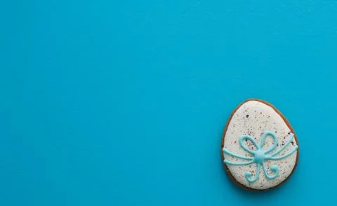 Easter ginger glazed cookies in the shape of an egg in a row. Stock Photos