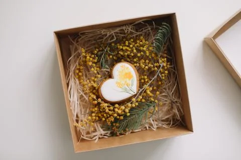 Easter gingerbread cookie in shape of a heart in a gift box with colorful yellow Stock Photos