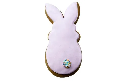 Easter gingerbread in the form of a pink rabbit isolated on a white backgroun Stock Photos