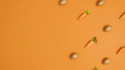 Easter glitter eggs and carrots make creative pattern. Stop motion 스톡 동영상 150276349
