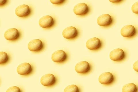 Easter golden eggs pattern on a yellow background 스톡 사진