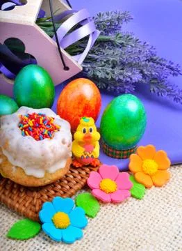 Easter green eggs with flowers, cake and chicken. Stock Photos