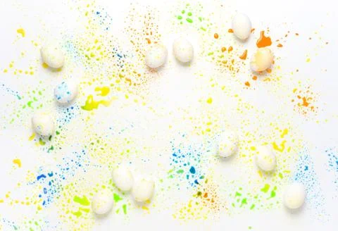 Easter greeting background with eggs paint splashes Stock Photos