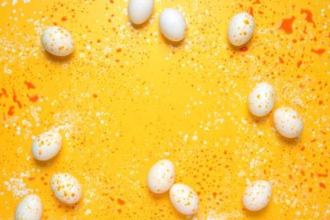 Easter greeting background with eggs paint splashes Stock Photos