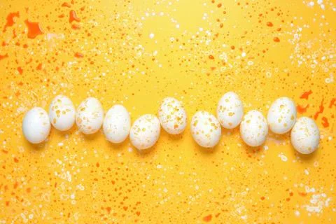 Easter greeting background with eggs paint splashes Stock Photos
