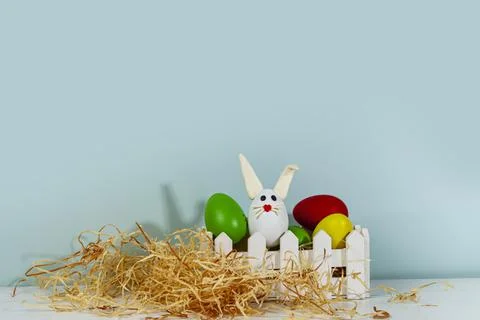 Easter greeting card. Easter egg with bunny ears on a stand. Stock Photos