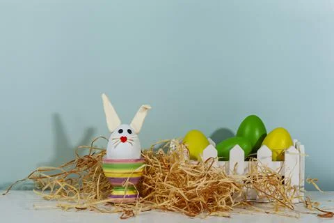 Easter greeting card. Easter egg with bunny ears on a stand. Stock Photos
