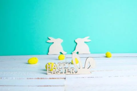 Easter holiday background. Easter bunny, eggs and text Happy Easter. Minimal  Stock Photos