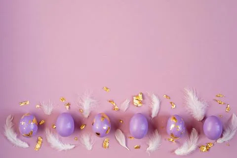 Easter holiday background, Easter eggs painted in very peri color on violet Stock Photos
