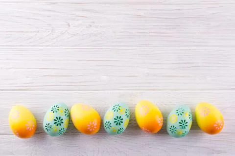 Easter holiday background with eggs. Top view of colorful painted  eggs Stock Photos