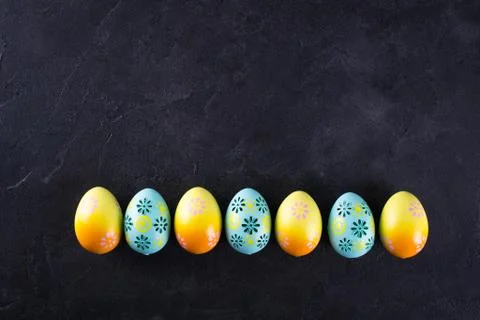 Easter holiday background with eggs. Top view of colorful painted chicken egg Stock Photos
