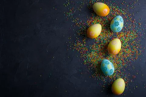 Easter holiday background with eggs. Top view of colorful painted chicken egg Stock Photos