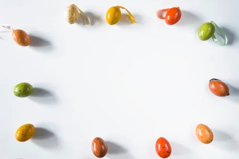 Easter holiday background. Frame of easter eggs on white background Stock Photos
