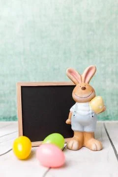 Easter holiday bunny and an empty blackboard Stock Photos