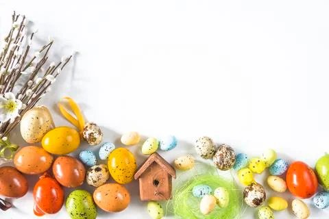 Easter holiday composition. Various easter eggs and bouquet of willow on whit Stock Photos