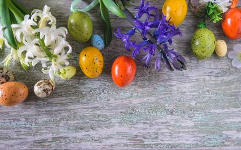 Easter holiday composition. White and purple hyacinth flowers and easter eggs Stock Photos