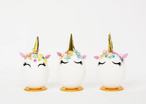 Easter holiday concept. Three eggs in the shape of a unicorn. Stock Photos